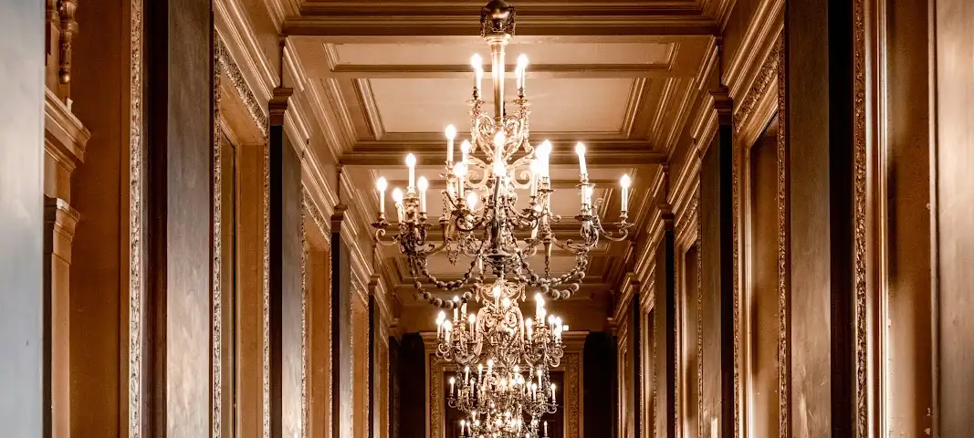 Grand chandelier-lit hallway, luxury interior