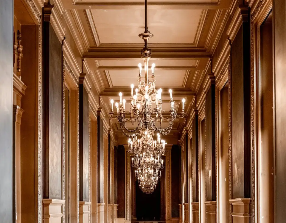 Grand chandelier-lit hallway, luxury interior